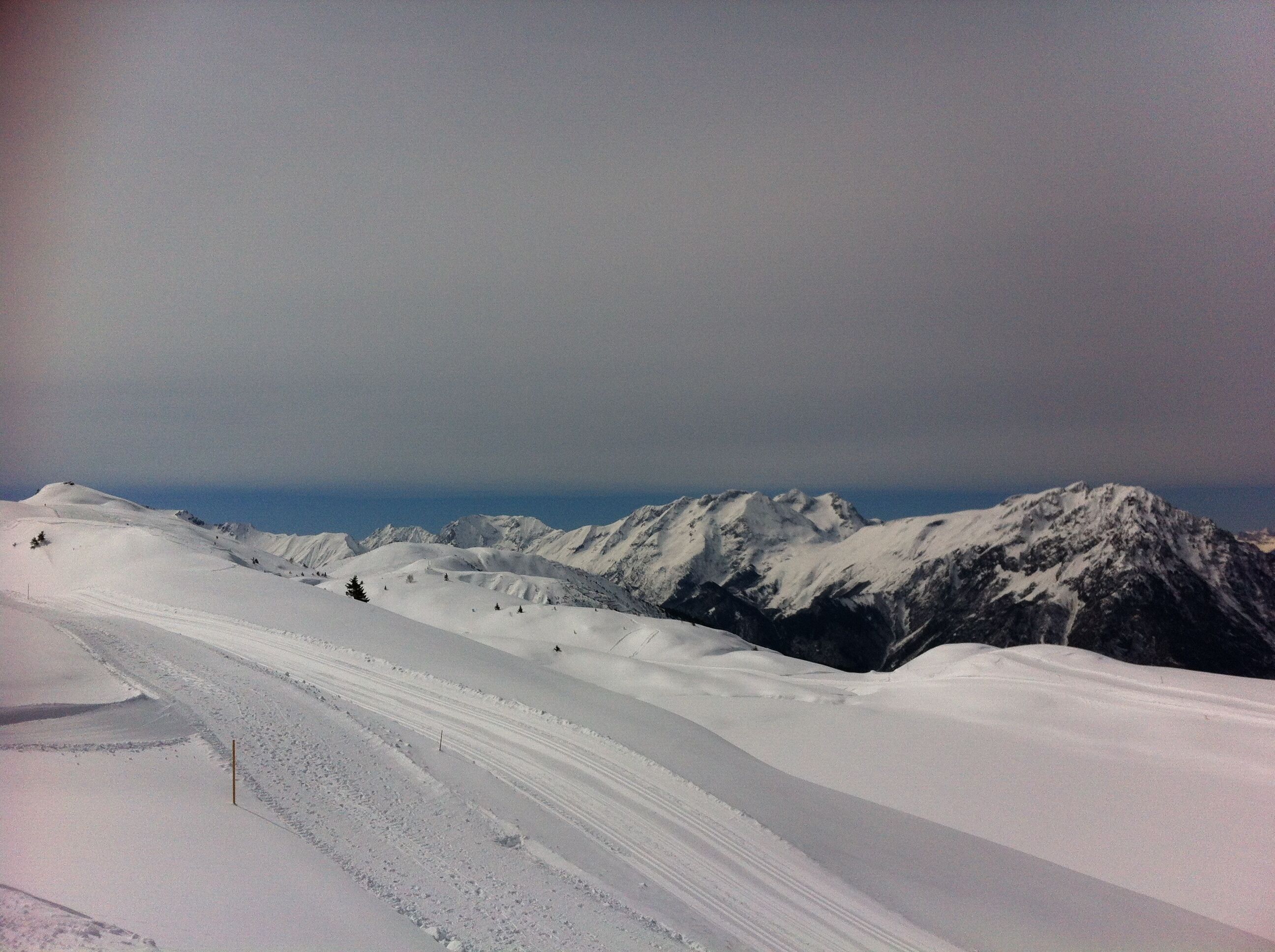 A snow-covered mountain landscape with a clear sky.