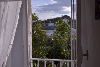 100m from the beach, apartment with river view, small garden for meals