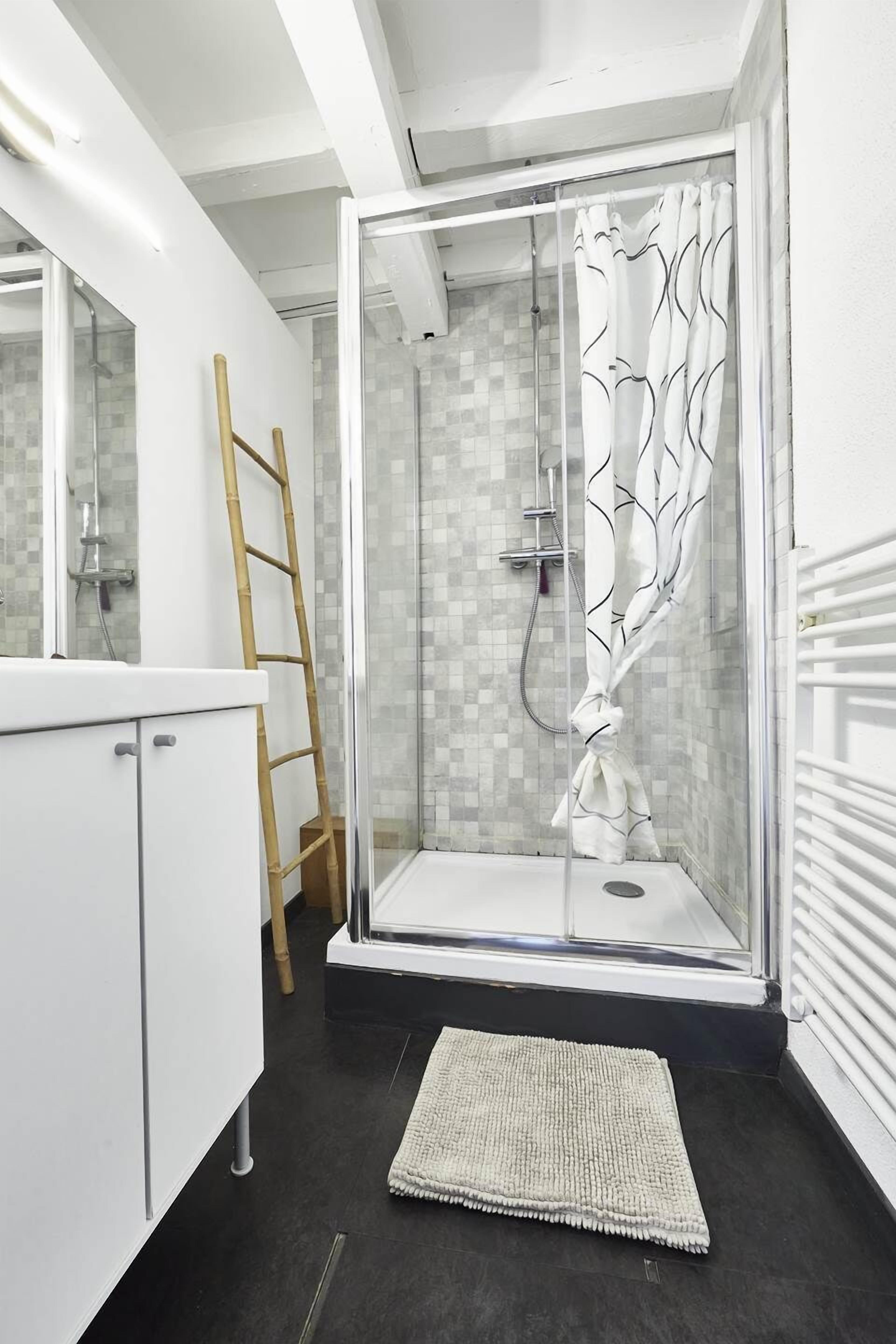 Shower, hair dryer, towels, toilet paper