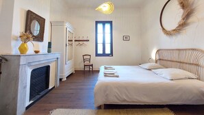 A bedroom with a bed, a mirror, a dresser, a chair, and a window. - 🌿Superb Maison de Maître in Provence with XXL infinity pool and bicycles🌿 (Beaucaire)