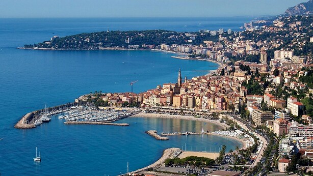 A coastal city with a marina, historic buildings, and a hilly backdrop. - VILLA FOR RENT (near the beach with swimming pool, garden barbecue). (Menton)