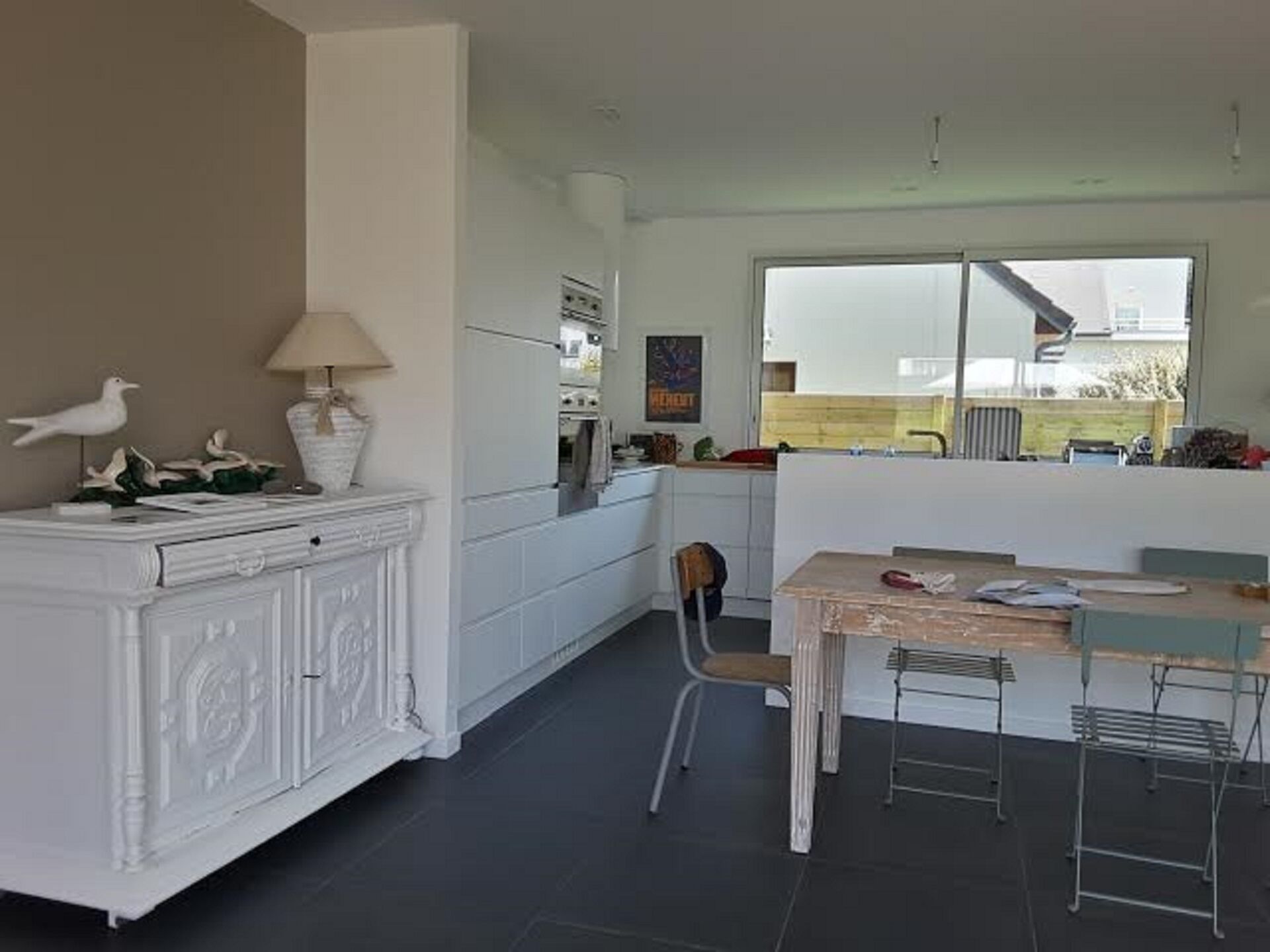 standing wooden house very close to beach