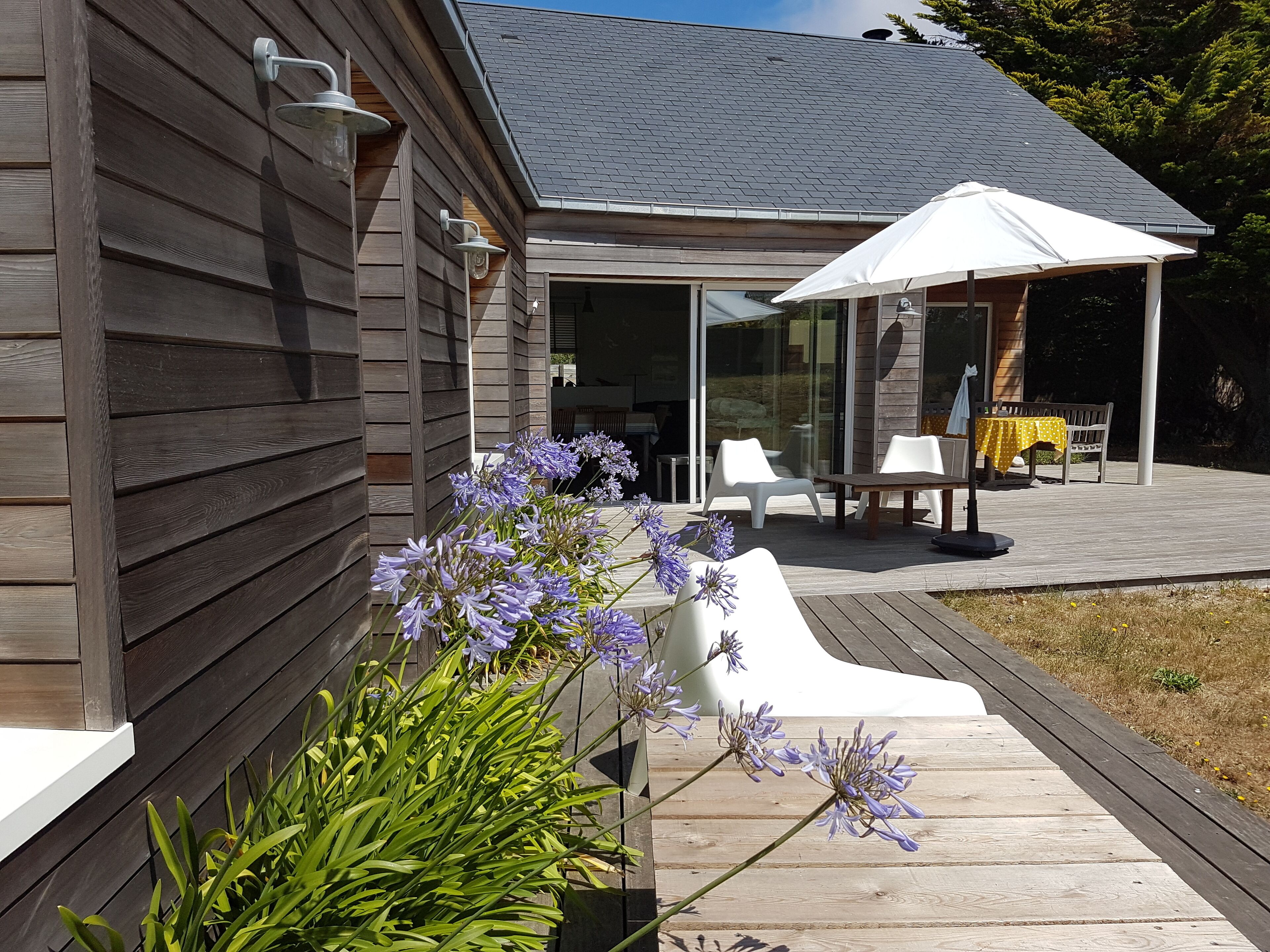 standing wooden house very close to beach