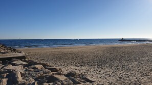 On the beach, sun-loungers