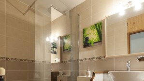 A modern bathroom with a glass-enclosed shower, a wooden vanity with a sink, and a mirror above the vanity. - La Maison du Patrel - Bed and breakfast_4 people (Ban sur Meurthe/Clefcy)