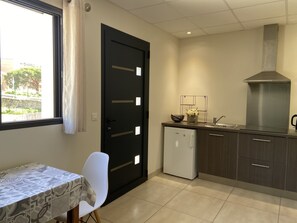 Fridge, microwave, stovetop, coffee/tea maker