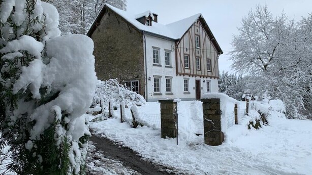 A large, two-story house with a steeply pitched roof, surrounded by snow-covered trees and a snow-covered driveway. - La Futaie de Chabrehez  (Les Tailles)