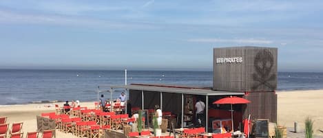 On the beach, sun-loungers