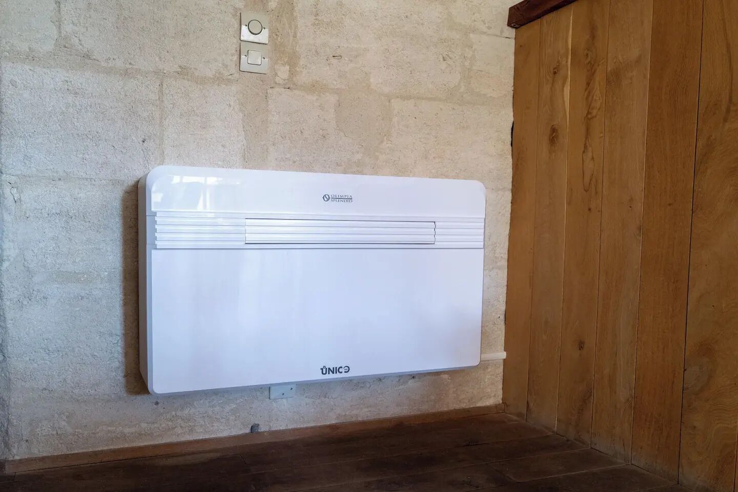 A white wall-mounted air conditioner with the brand name "UNICE" visible.