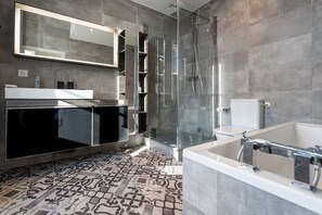Bathtub, hair dryer, towels, soap