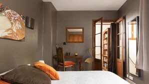 A bedroom with a bed, pillows, a desk, a chair, a bookshelf, and a large window. - House borders of Marne, between Disney and Paris! (Le Perreux-Sur-Marne)