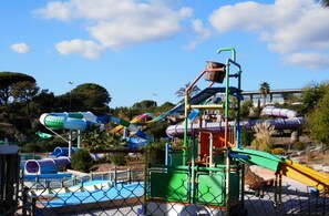 A water park with various slides and play structures. - Beau Mazet 75m2, large garden in pine forest, Private domain with Swimming pool, Tennis .. (Sainte-Maxime)