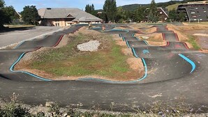 A skate park with various ramps and tracks.