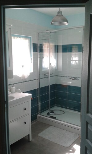 Shower, hair dryer, towels, soap
