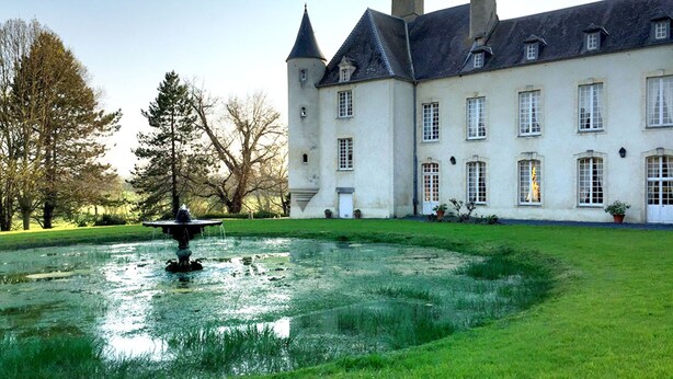A large, historic building with a symmetrical facade, multiple windows, and a central tower. - Château d'Asnieres en Bessin (Asnieres-en-Bessin)