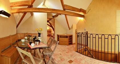 peaceful farmhouse surrounded by fields and woods, renovated comfort