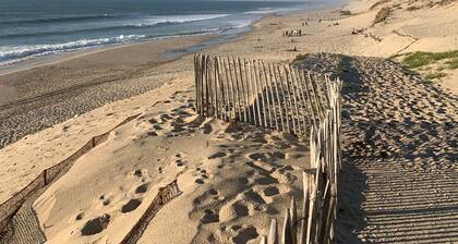 Wooden house close to the ocean in a gated community.