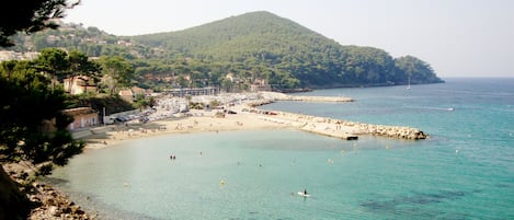 On the beach, sun-loungers