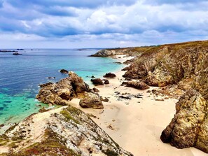 On the beach, sun-loungers