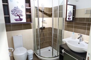 Shower, hair dryer, towels, soap