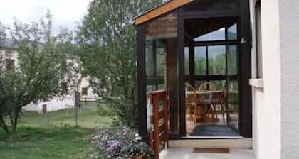 Large self-catered chalet, mature garden, all mod cons, south oriented veranda