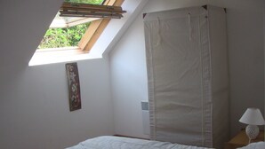 A bedroom with a skylight, a bed, a nightstand, a lamp, and a curtain. - RESTORED FARM LAND LEISURE & SON IN QUIET AT THE EDGE BRAYE (Savigny-Sur-Braye)