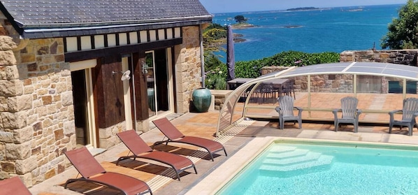 Outdoor pool, a heated pool - Beach view villa at the end of the garden covered swimming pool heated all year round (Lanmodez)