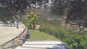 A stone staircase leading down to a grassy area with a small building and trees. - Facing the sea and the Estérel massif, Antheor, town of Saint Raphaël  (Saint-Raphaël)