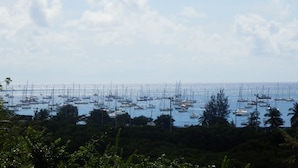A marina with numerous boats docked under a clear sky. - Sainte-Anne, typical villa for 4-6 people Sea view, directly on the beach. (Sainte Anne)