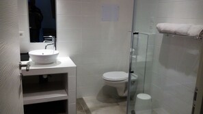 Shower, hair dryer, towels, toilet paper