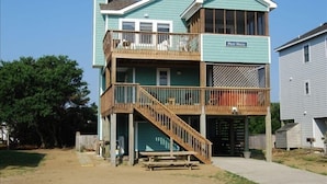 A two-story building with a balcony on the upper floor, labeled "Pilot House."