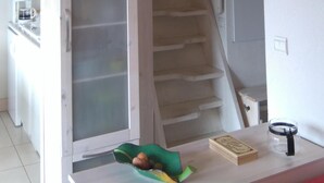A staircase leading to a second floor with a kitchen area below. - Apartment for 6 people, nicely decorated, located on the edge of the slopes (Crest-Voland)