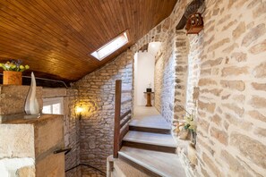 A stone staircase with wooden railings, a skylight, and a wall-mounted light fixture. - BSH - Beaune Allerey - Parking included (Beaune)