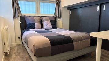 1 bedroom, desk, iron/ironing board, travel cot