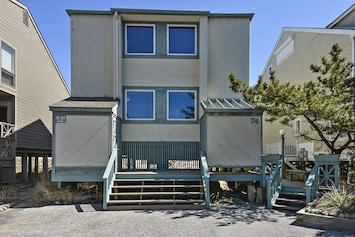 Streetside of house from private parking lot