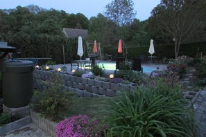 A garden with a pool, outdoor furniture, and a variety of plants. - NoOaks (Meissen)