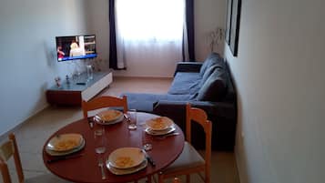 City Apartment | Living area | Flat-screen TV