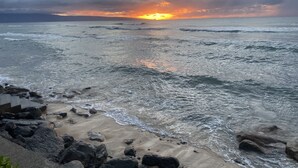 A beach with waves and a cloudy sky. - Ocean View Upgraded Top Fl HOKU711 Shaded Lanai see condo comparison chart  (Lahaina)