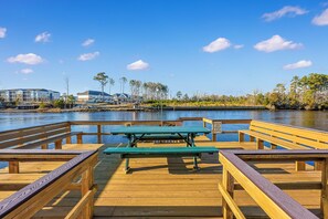 Outdoor dining - Affordable cozy 2 bedroom condo 1st floor screened in patio in gated community. (North Myrtle Beach)