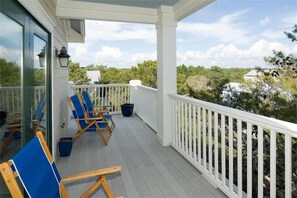 Relax in a serene outdoor space with a view of the surrounding landscape, featuring comfortable seating and a picturesque view.