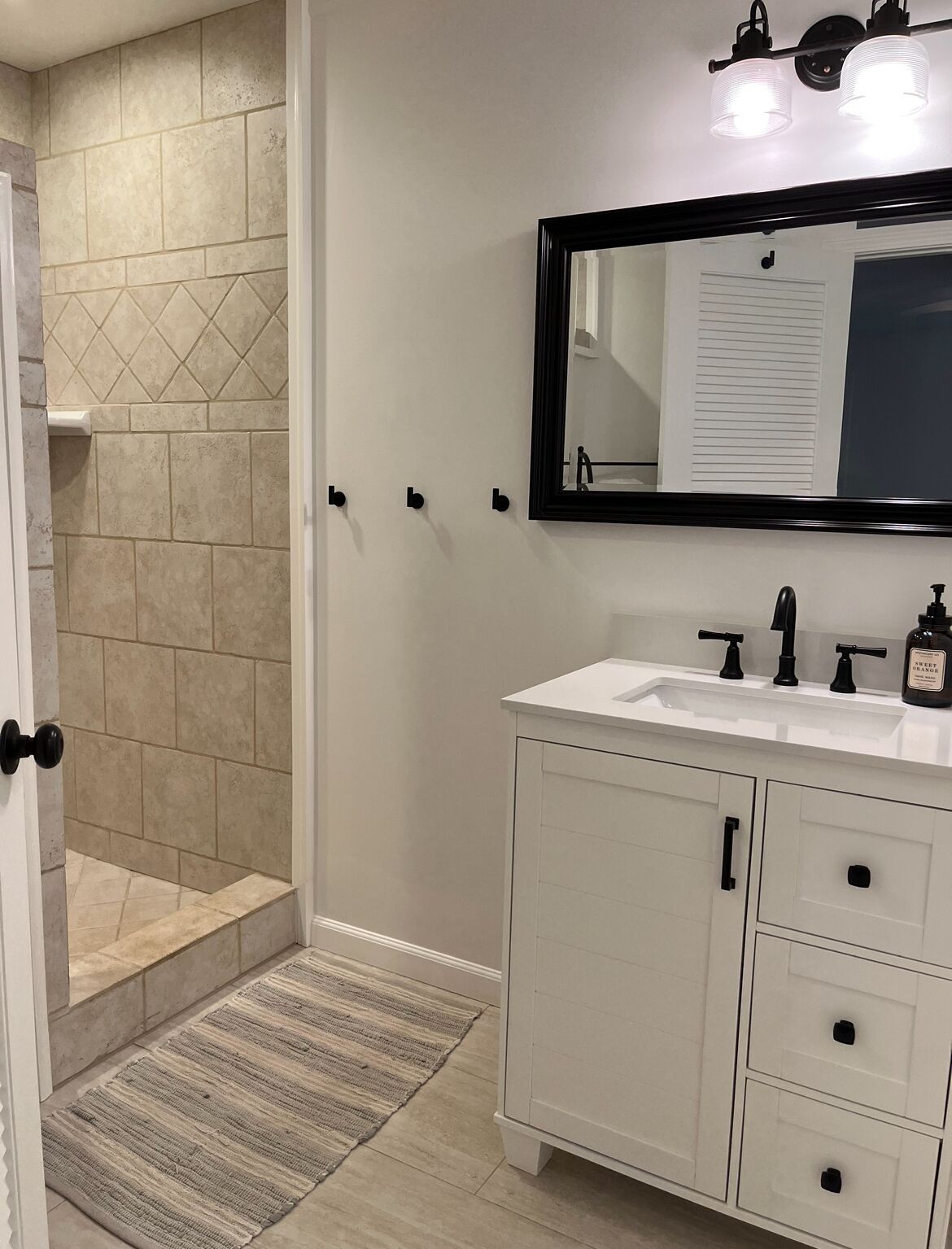 Bathtub, hair dryer, towels, toilet paper