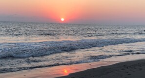 On the beach, sun-loungers, beach towels