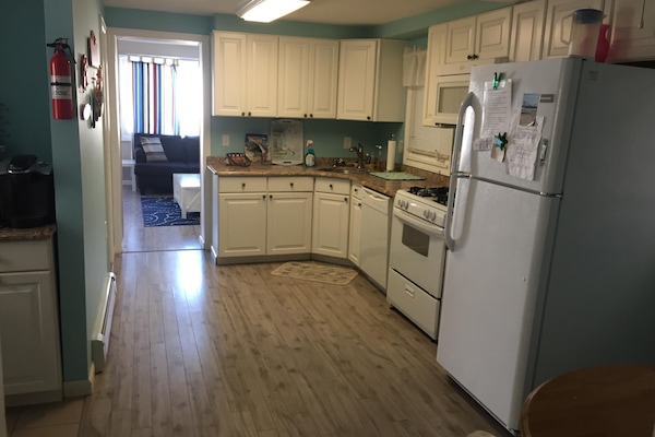 Spacious kitchen with beautiful Italian granite counter tops with dinette