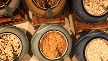A selection of bowls containing different types of cereal.