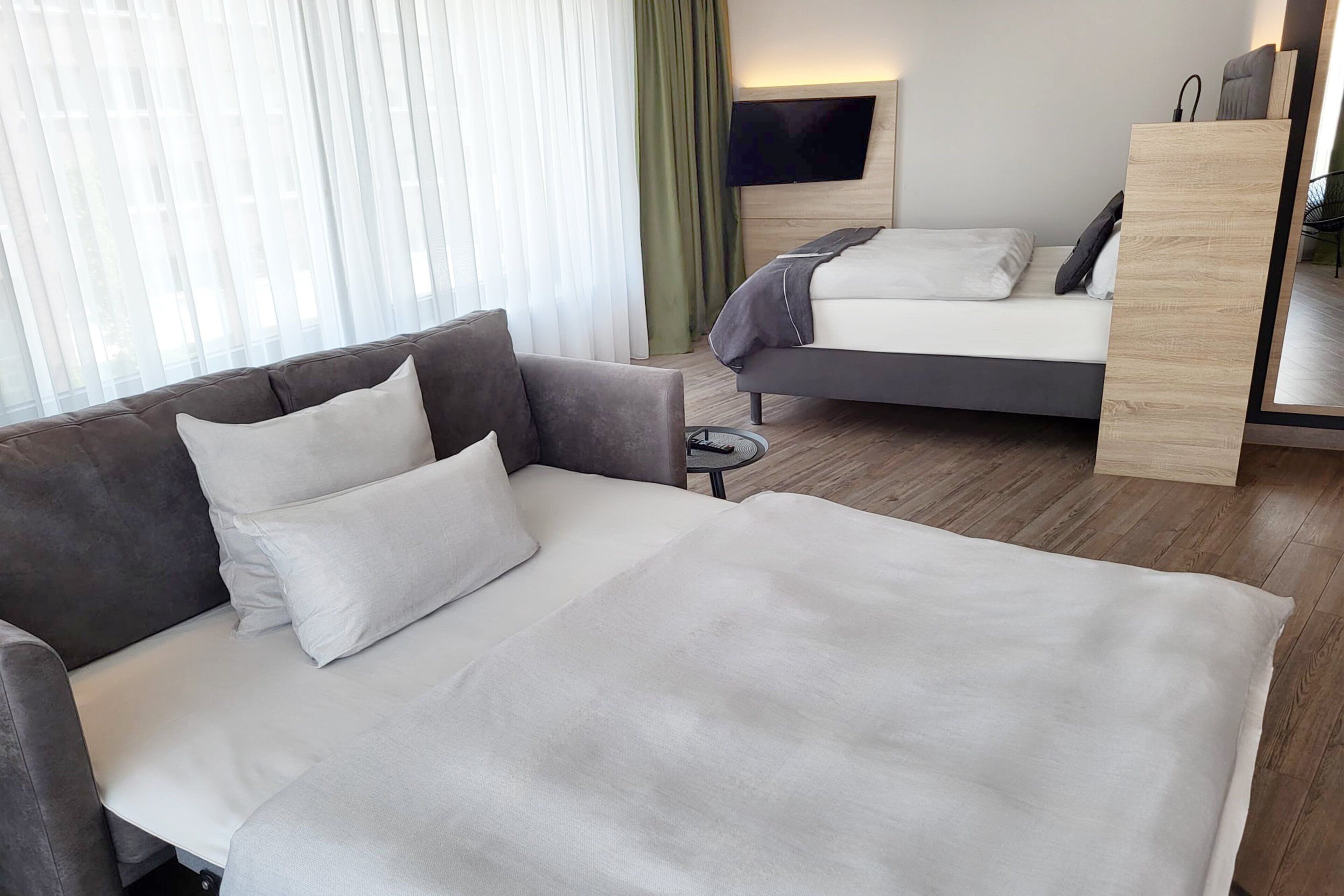Premium Room, 1 Queen Bed with Sofa bed, Kitchenette (Family Room) | 1 bedroom, hypo-allergenic bedding available, in-room safe