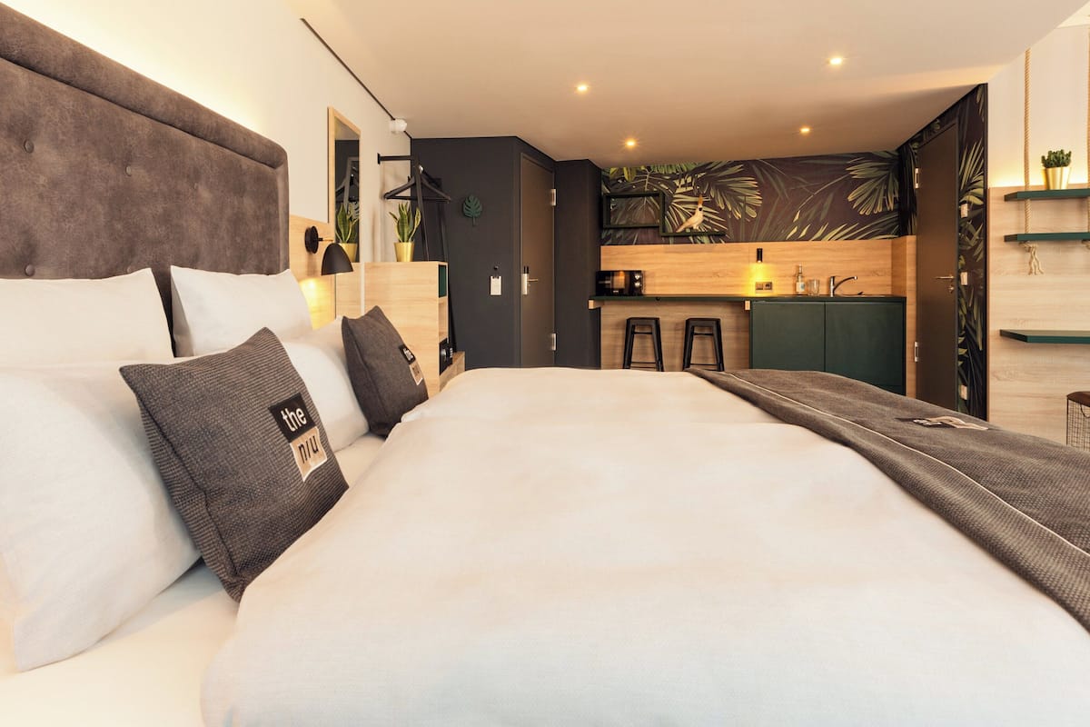 premium room, 1 queen bed | hypo-allergenic bedding, in-room safe, blackout curtains, soundproofing