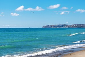 On the beach, sun loungers, beach towels