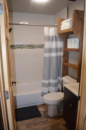 Combined shower/bathtub, towels, soap, toilet paper - Controlled Chaos Basecamp - centered between Jackson & Clark County Trail System (Merrillan)