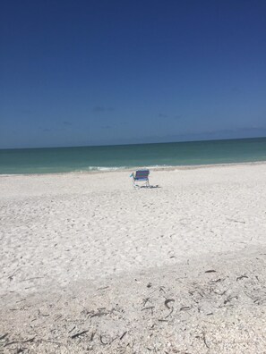 On the beach, sun loungers, beach towels