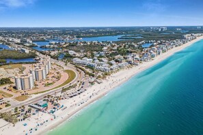 On the beach, sun-loungers, beach towels